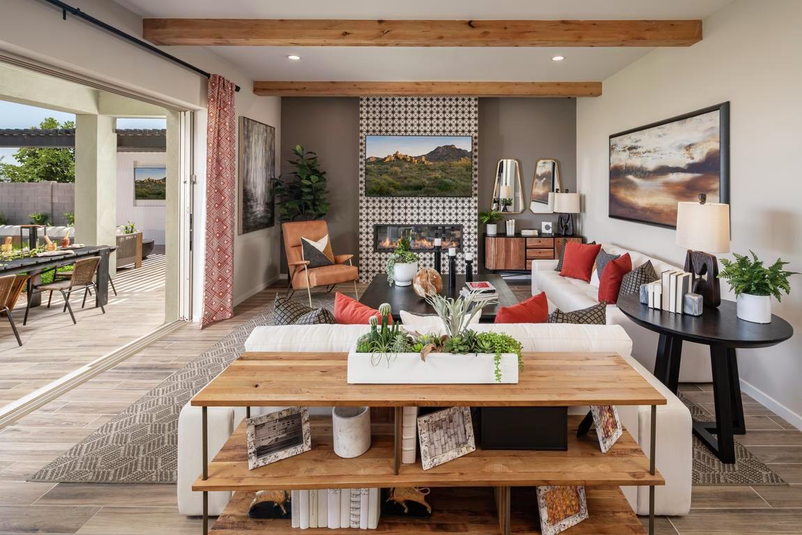 Rustic great room elevated by wood ceiling beams and natural elements