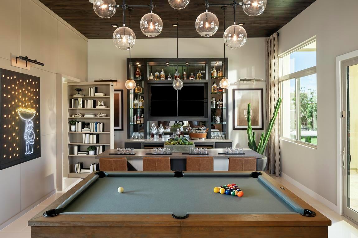 Fun-filled game room spotlighted by home bar and pool table