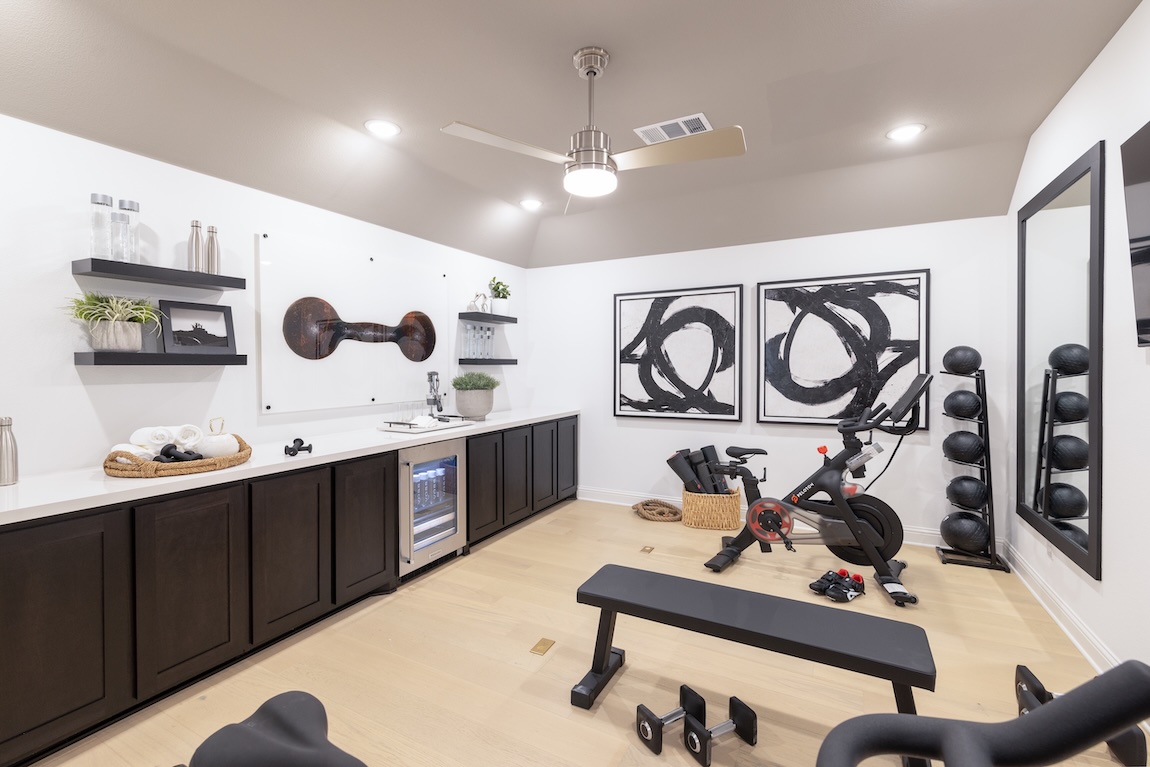 home gym with artwork and equipment