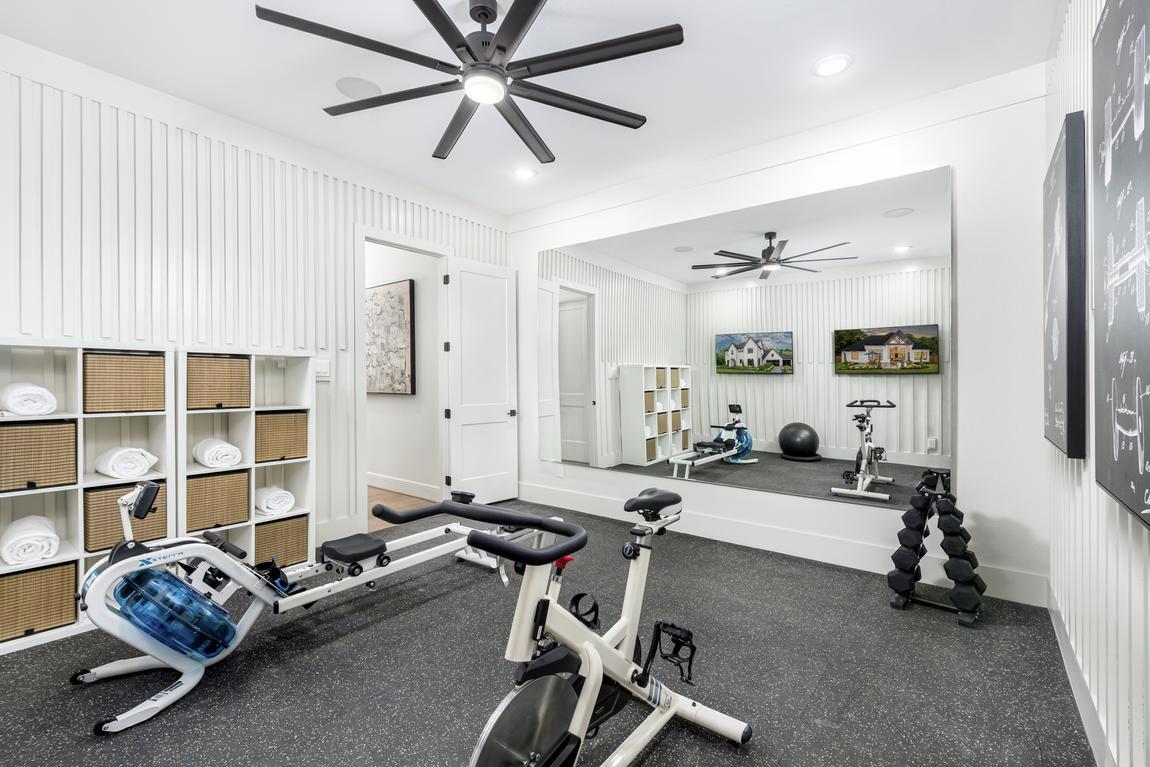 Home gym design with row machine and stationary bike