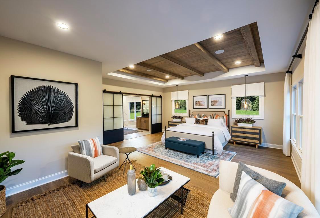 luxe bedroom highlighted by wood ceiling accent