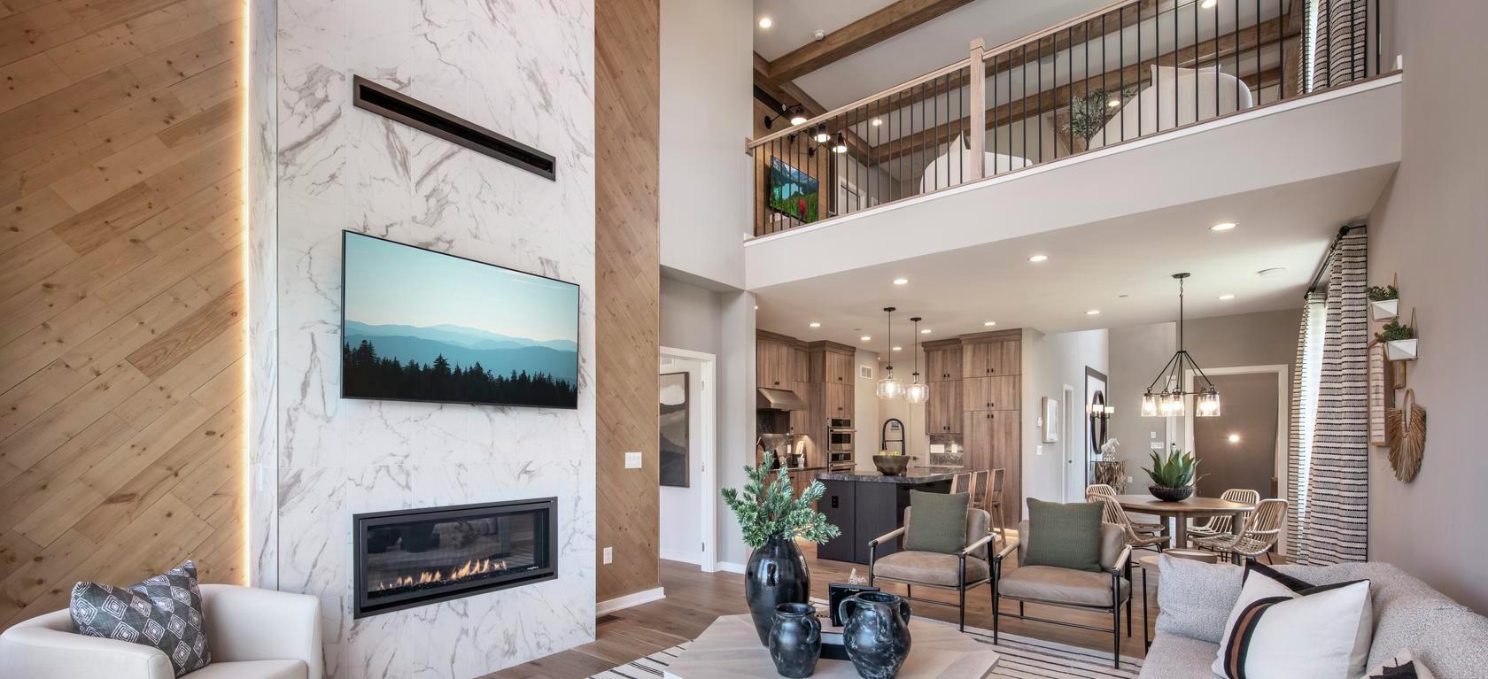 Great room design with marble fireplace and loft.