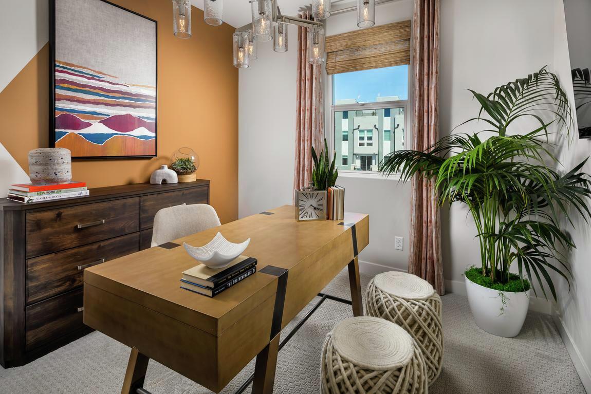 home office with orange accent wall