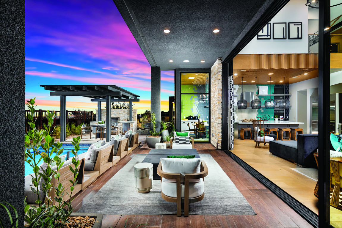 indoor to outdoor covered patio with hard wood floors, gray carpet, matte black finishes and pool