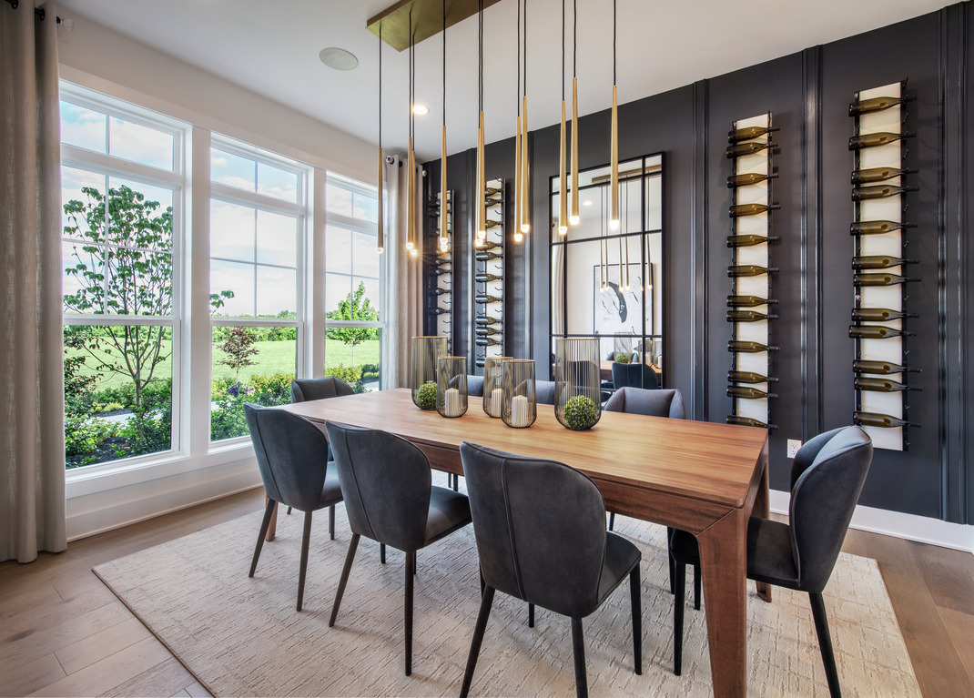 Dining room with dark color palette and wood accents