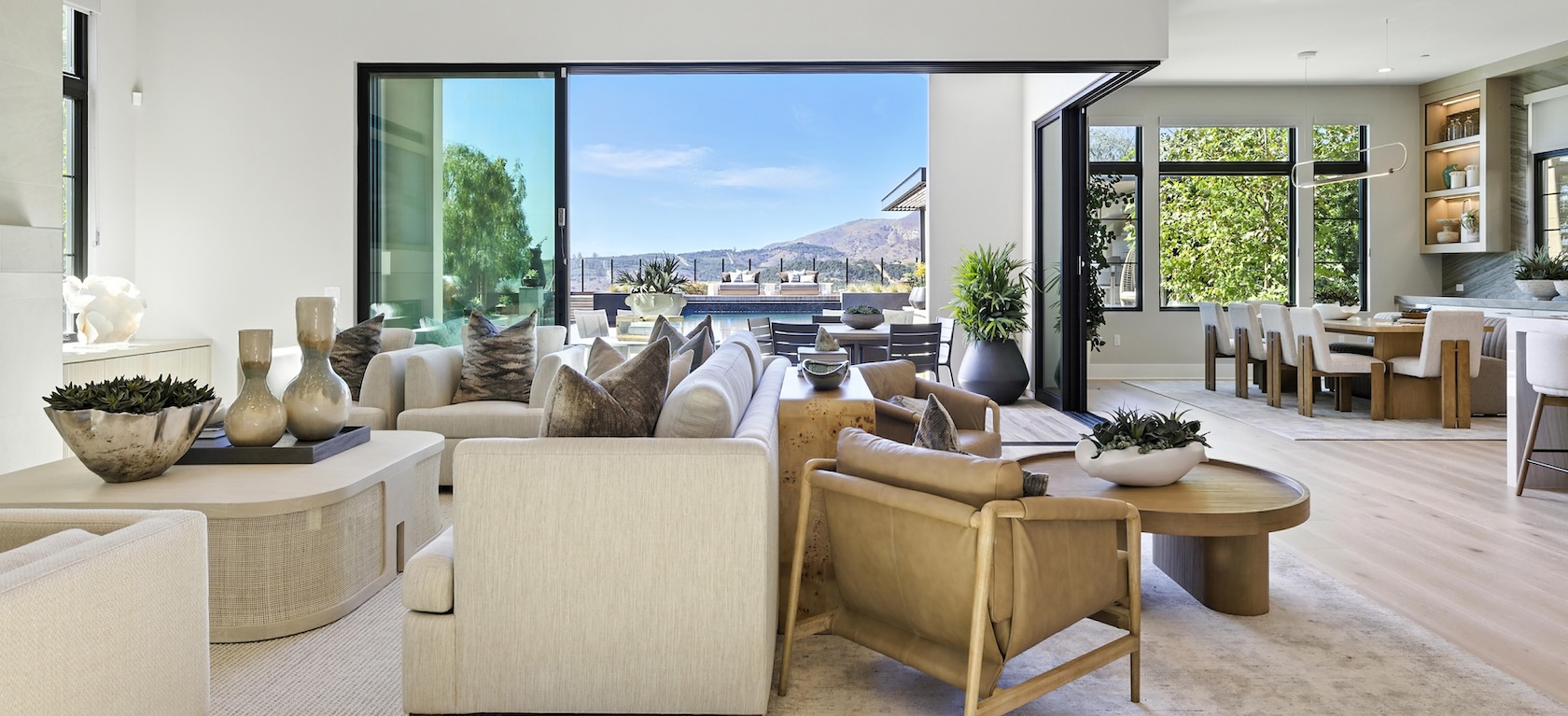 great room connected to dining space and outdoor living space