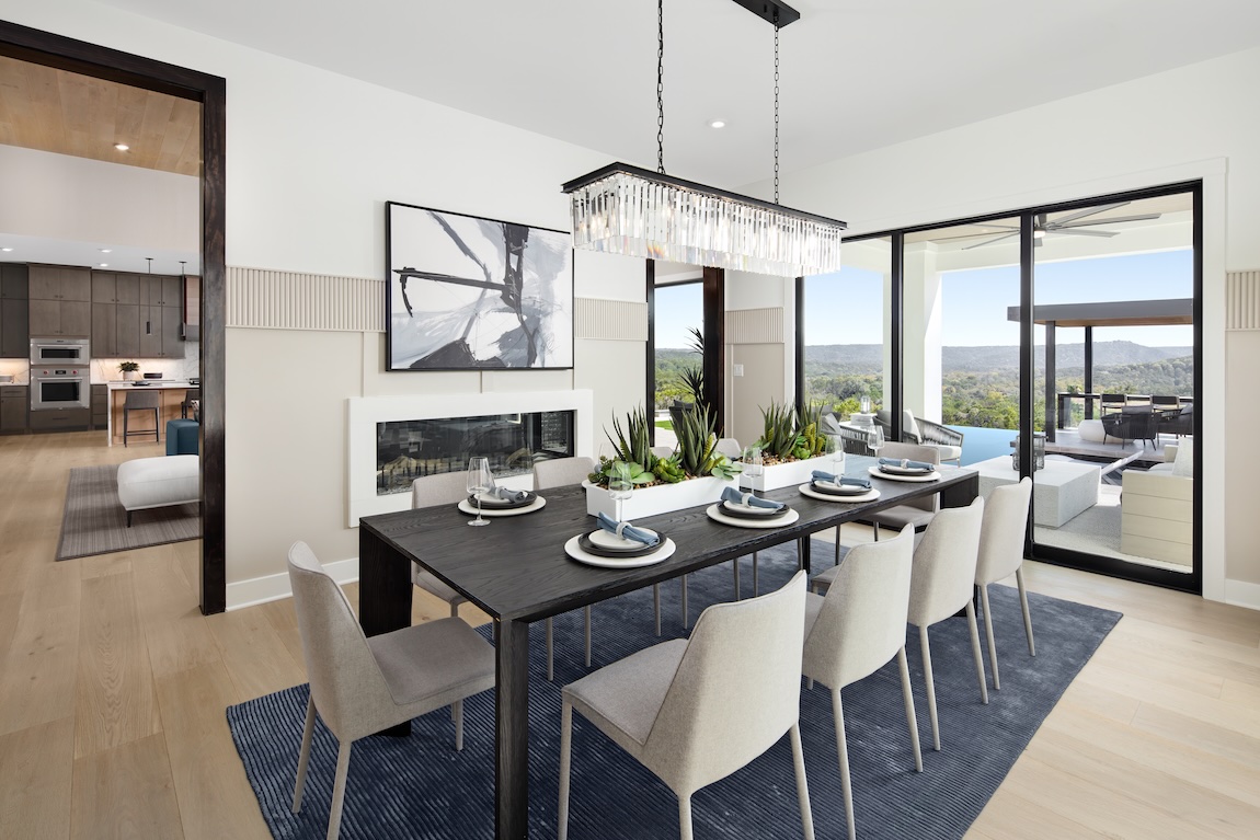 luxury dining room with glass lighting and table setting
