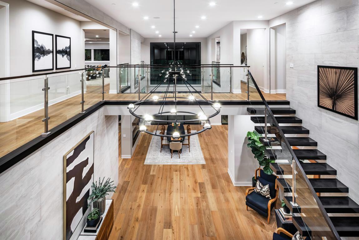 Contemporary foyer with statement lighting fixture