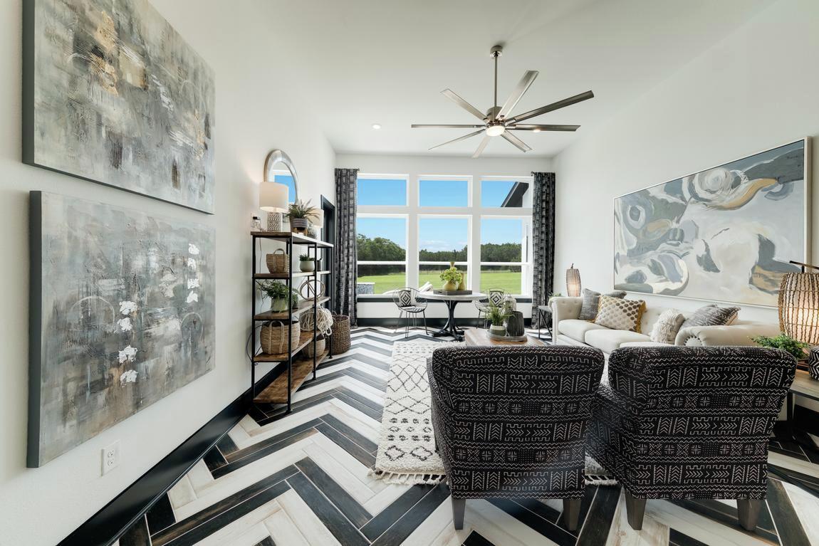 High-contrast flex space utilizing geometric patterns and gray-scale color palette.