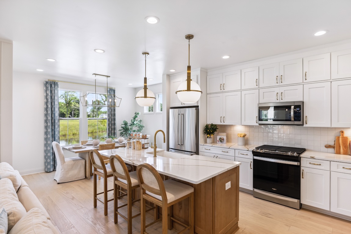modern kitchen with marble island and wood cabinetry