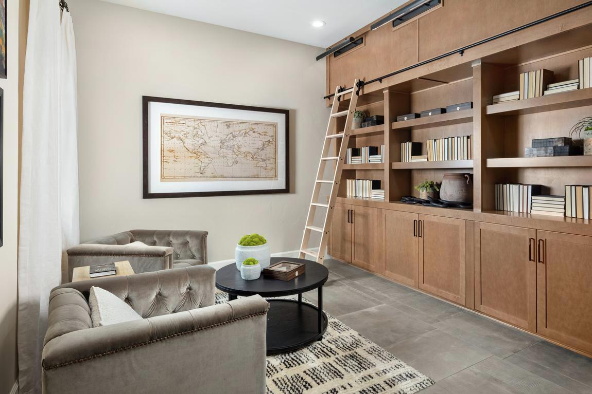 Library flex room with innovative bookcase featuring functional ladder