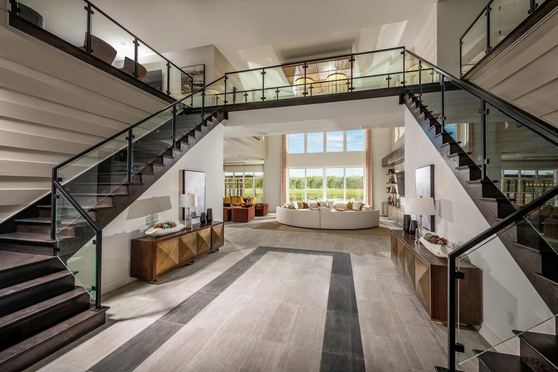 Dual staircase design in two-story foyer