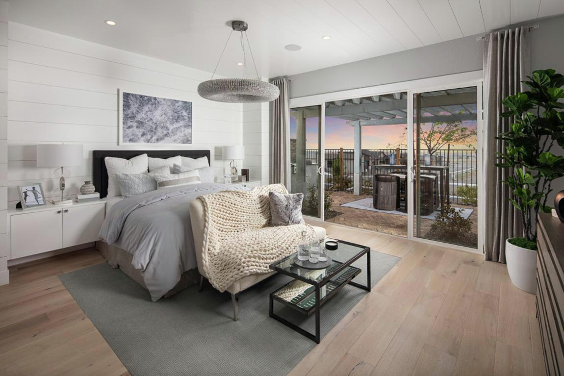 Contemporary bedroom featuring shiplap walls and outdoor transition