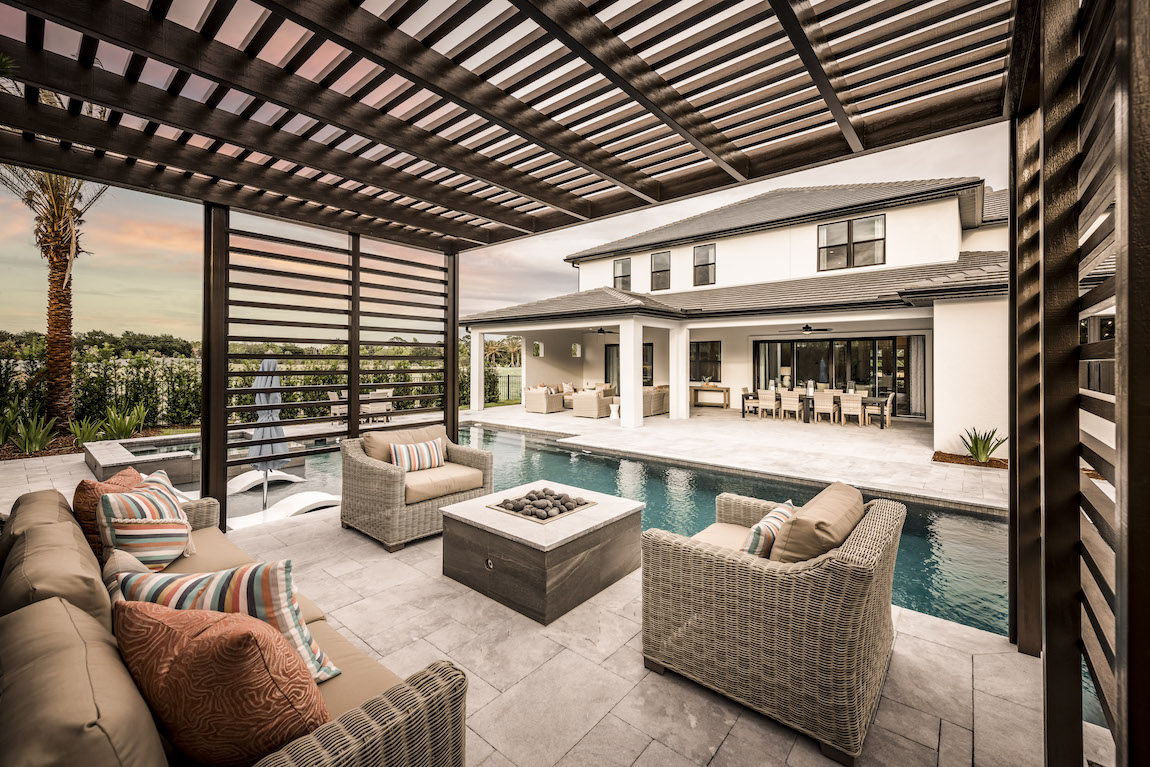 luxe outdoor living design featuring deck and pool