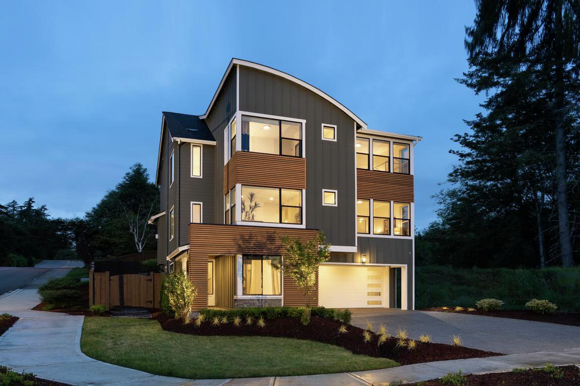 Move-in ready home with modern uplighting and board & batten siding.