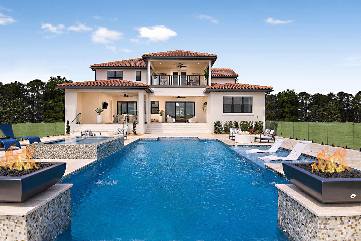 Luxury home design featuring multiple indoor-outdoor living features