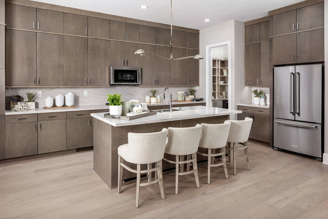 modern kitchen featuring neutral colors, plaster features, and other elements of Organic Modern design
