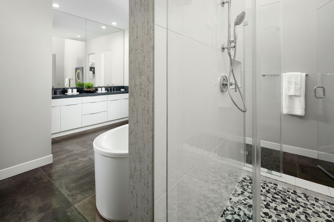 Bathroom with shower that utilizes terrazzo flooring