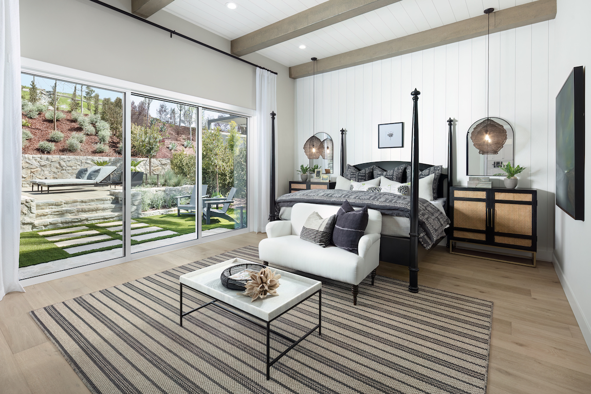 Bedroom highlighted by indoor-outdoor transition to backyard