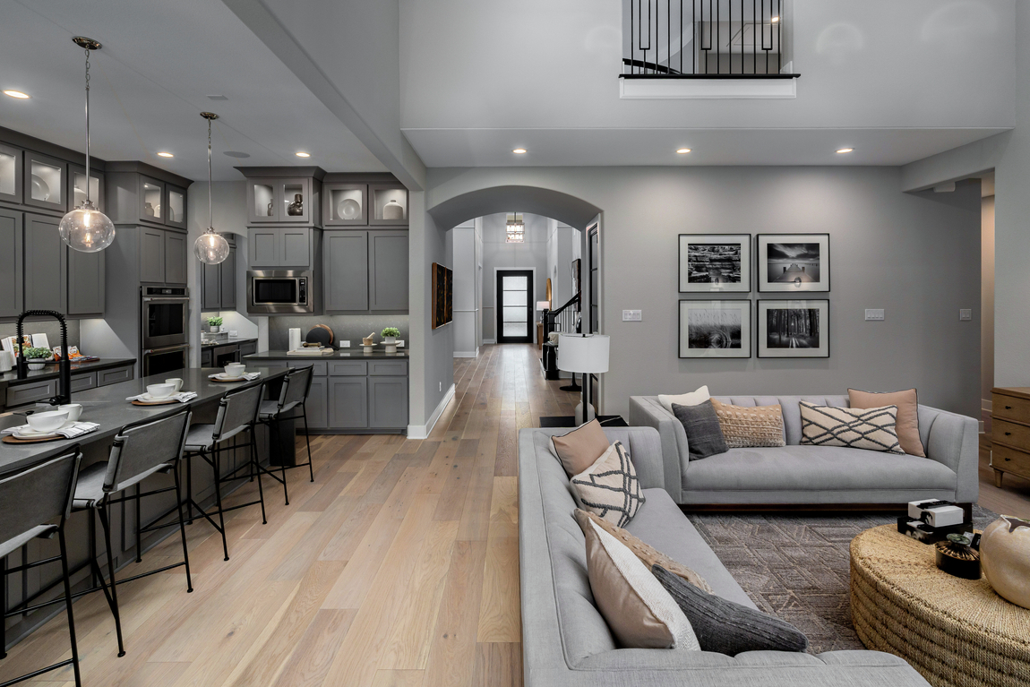 Luxury interior design highlighted by foyer hallway accentuated by curved architectural framing