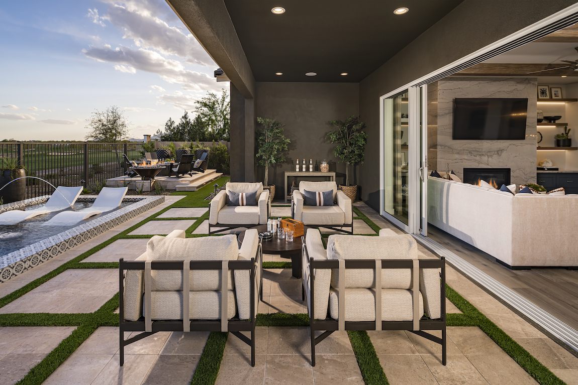luxe patio design which acts as an extension of the great room through the utilization of sliding glass doors