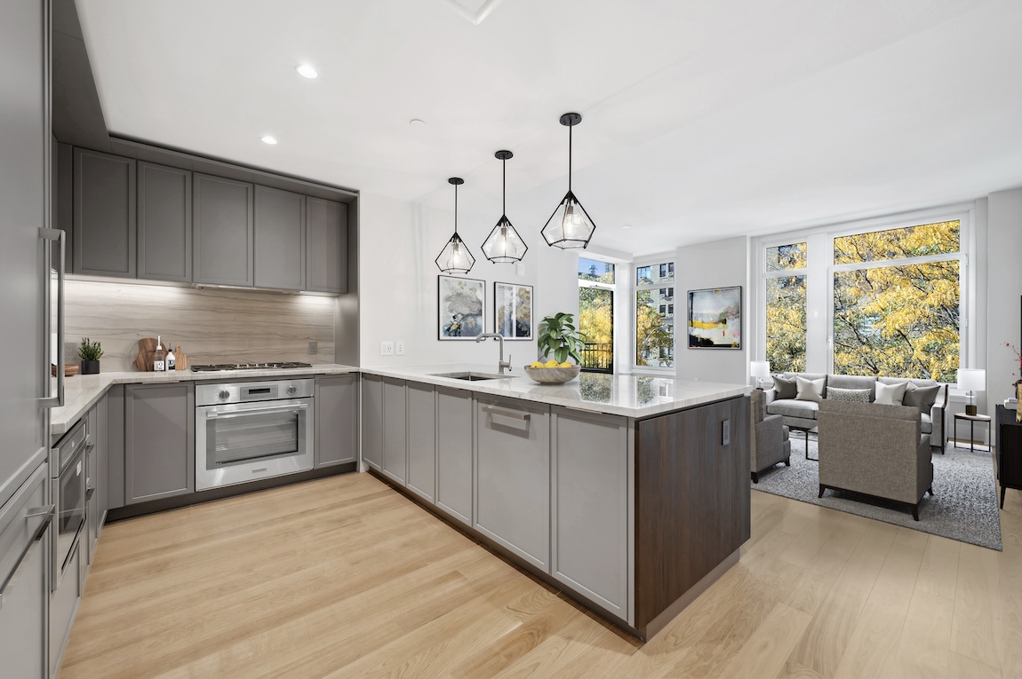 modern kitchen with pendant lighting above counters