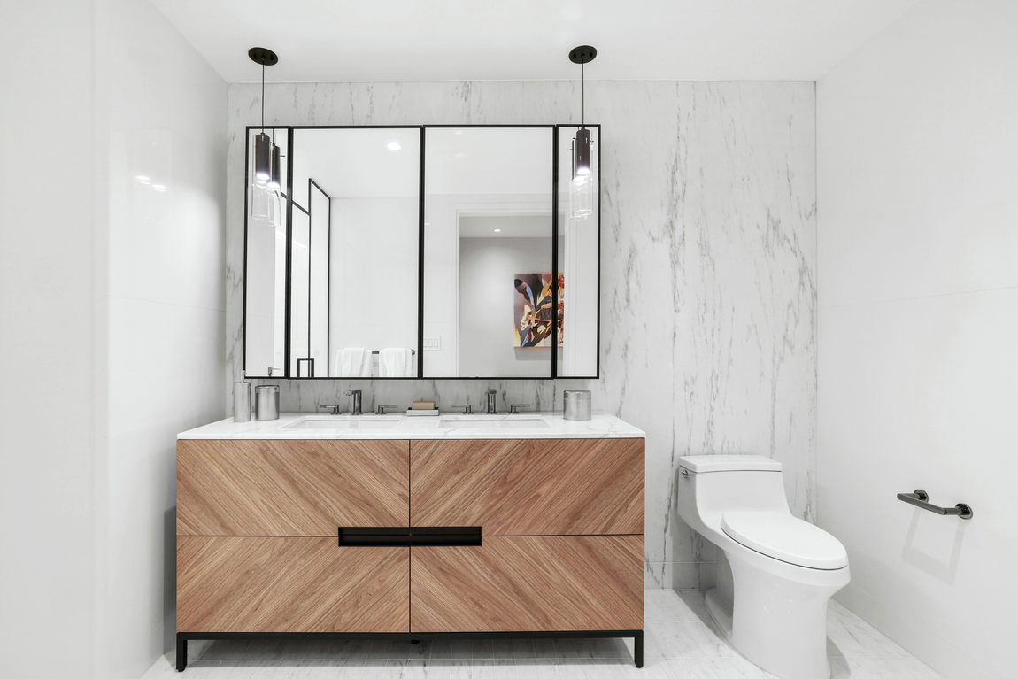 Sleek, modern bathroom design with wood vanity design