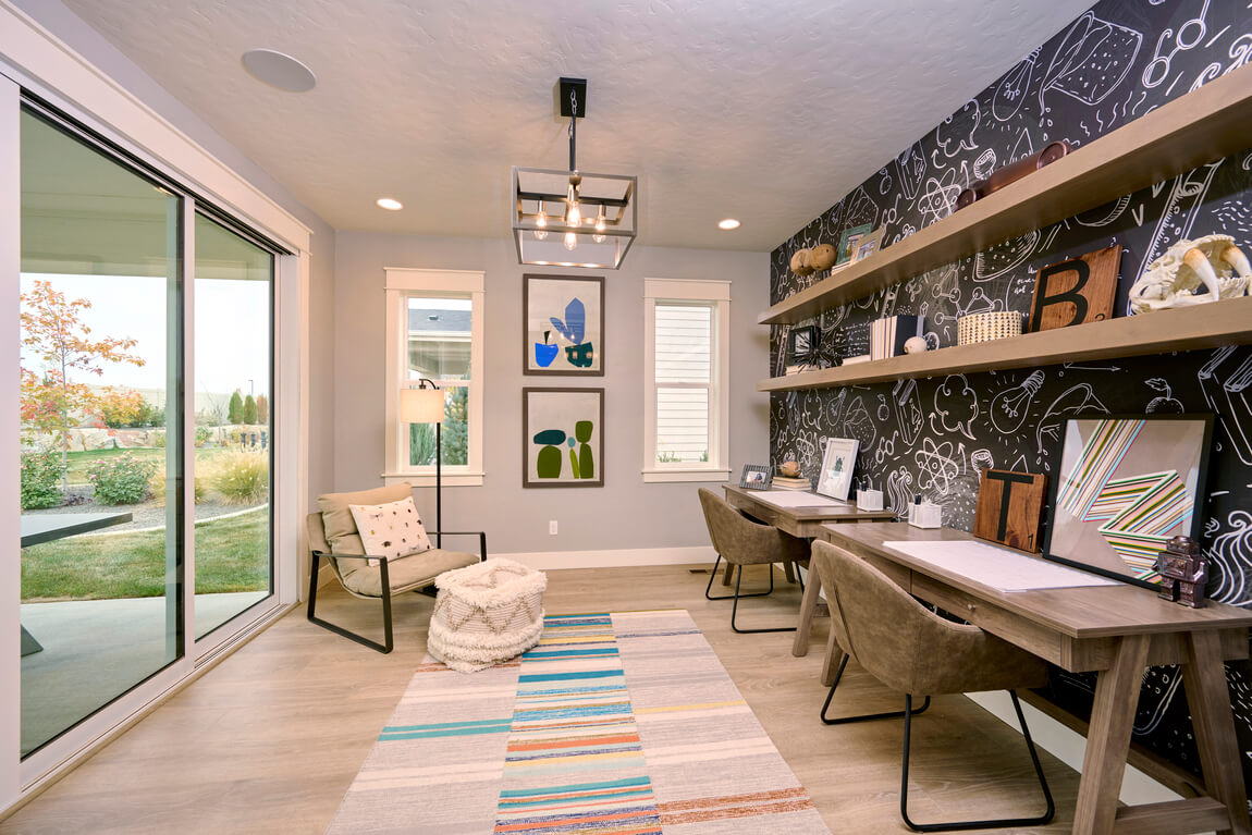 Home office space with contrasting black wallpaper