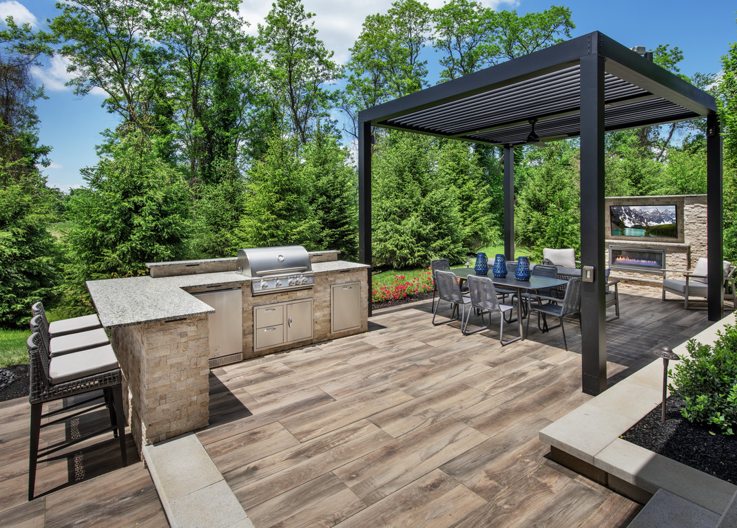 Luxury patio design with outdoor kitchen and dining area