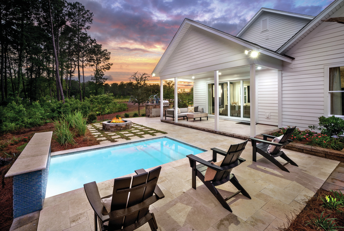 Outdoor patio with luxury decor and poolside seating