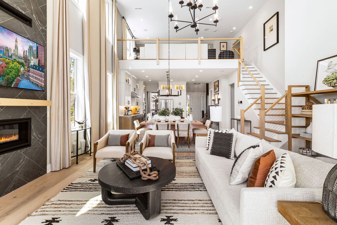 Two-story interior design highlighted by overlooking loft and open-concept layout