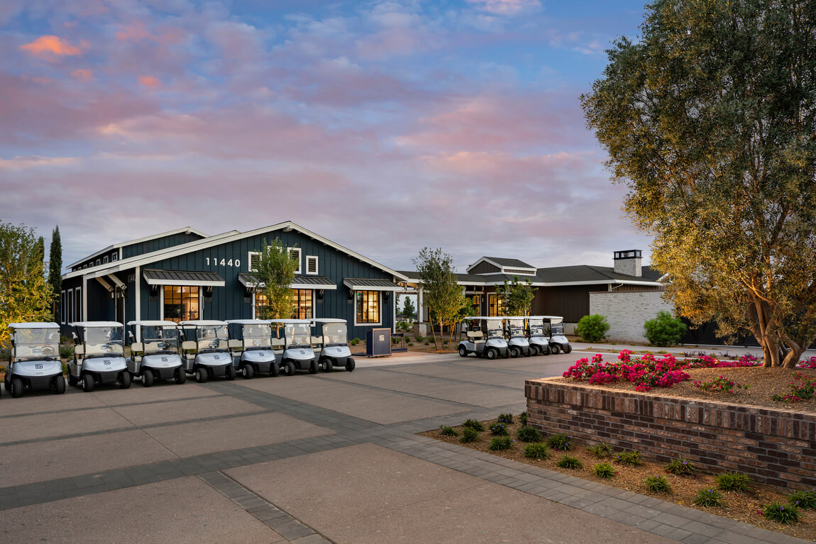 Sterling Grove clubhouse with golf carts out front