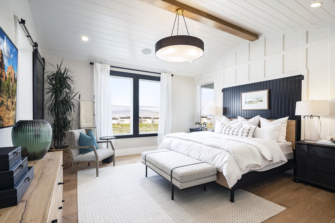 Luxe modern bedroom with beam ceiling featured in home design from Westlake Vistas