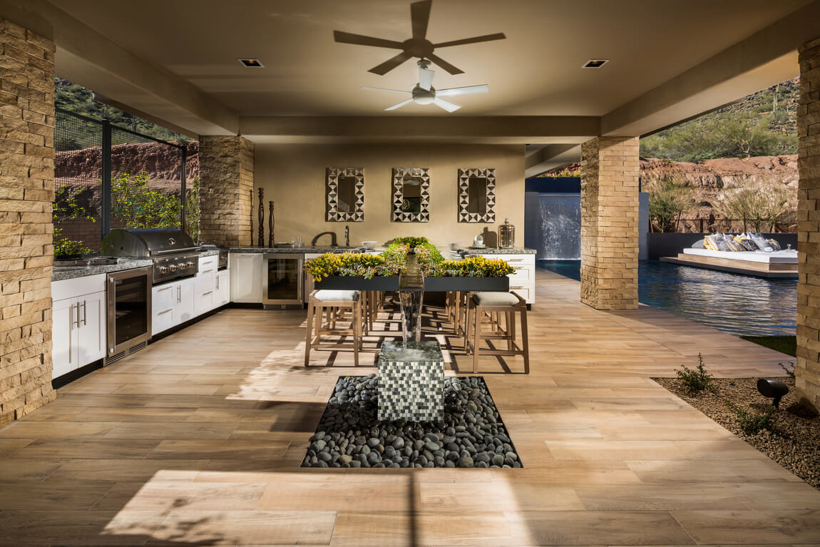 Modern patio featuring southwestern design elements such as foliage, wood flooring, and natural elements