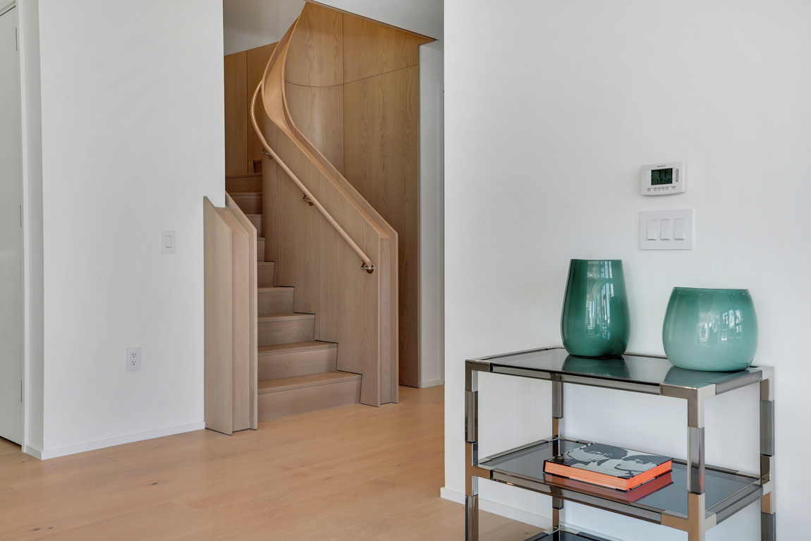 Luxury spiral staircase design in condo space