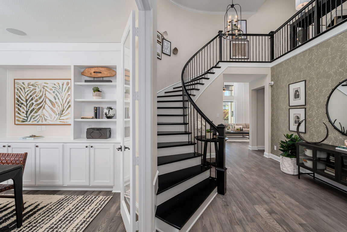 Modern type of staircase called a curved staircase in a foyer