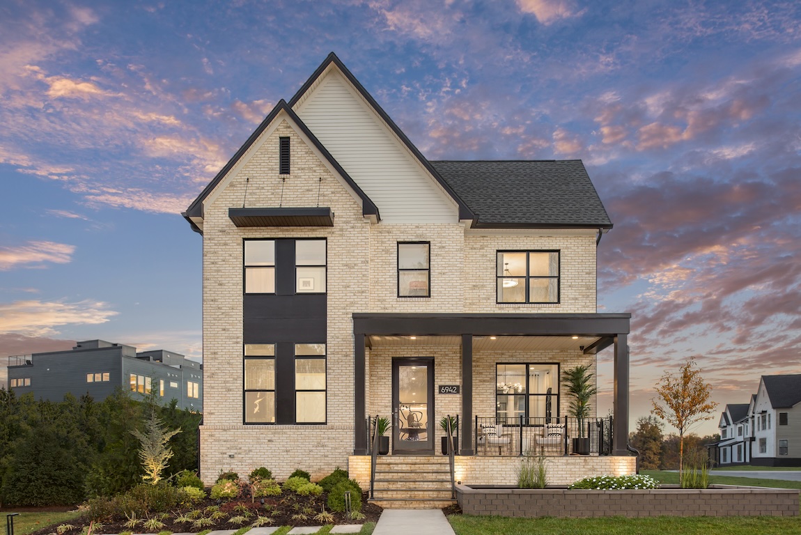 front exterior with porch featuring lighting