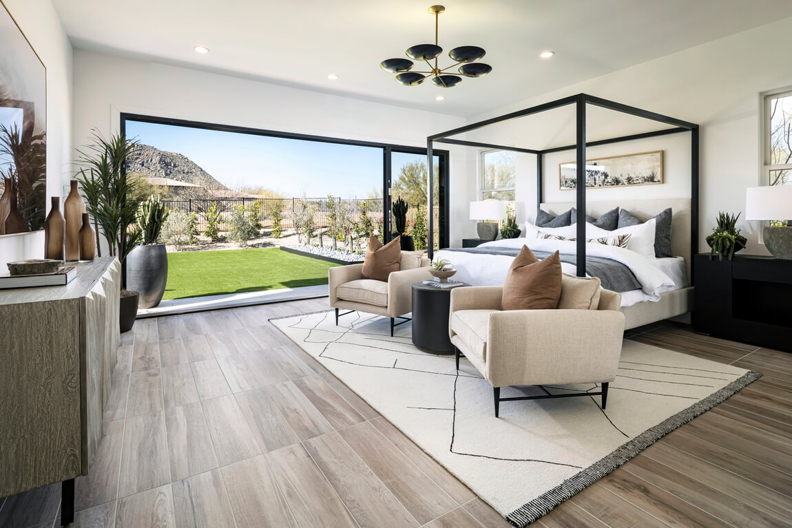 Modern bedroom featuring indoor-outdoor transition to backyard