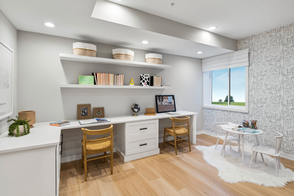 Shared desks in a children's workspace with extra seating