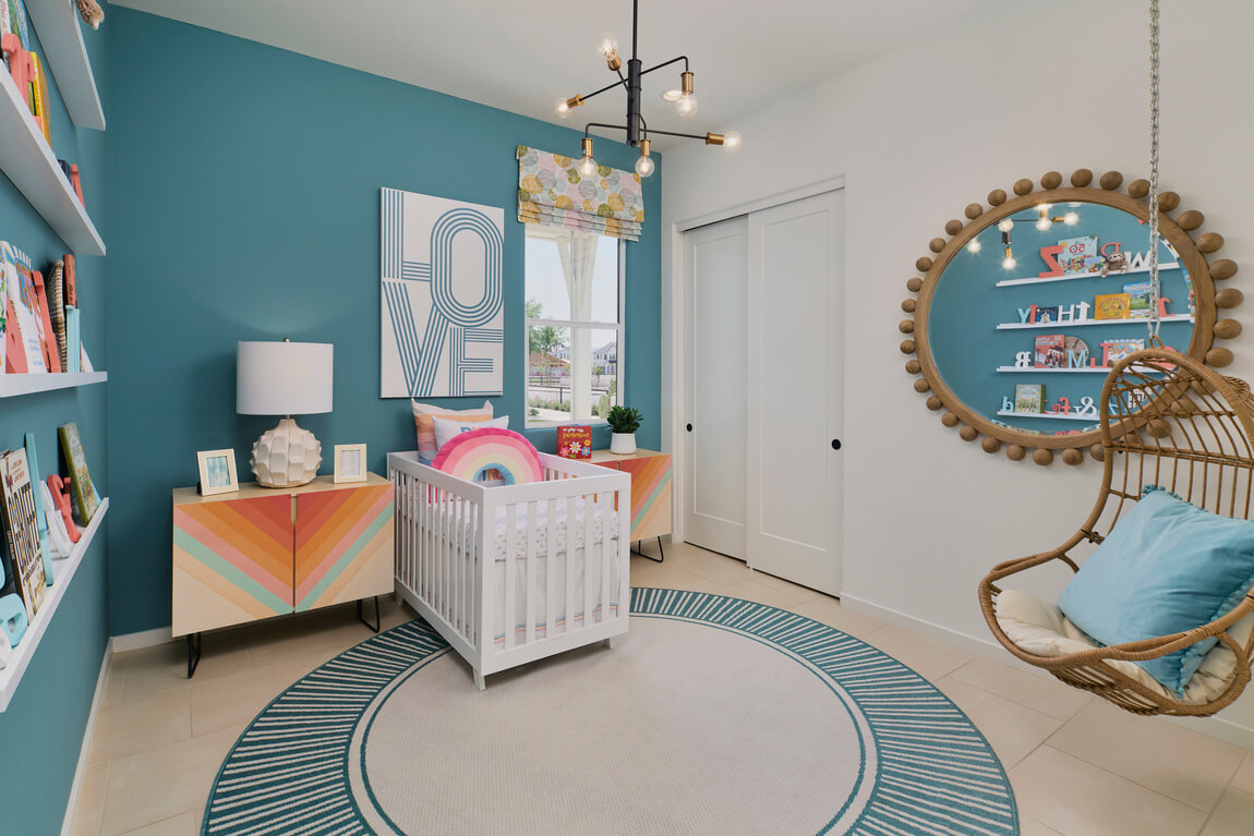 Bold nursery infused with refreshing aquamarine accents and matching decor