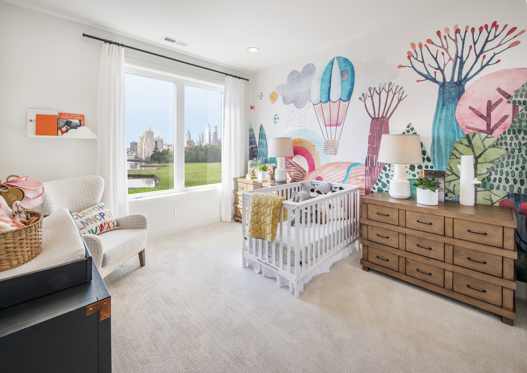 nursery design idea featuring illustrative wallpaper design