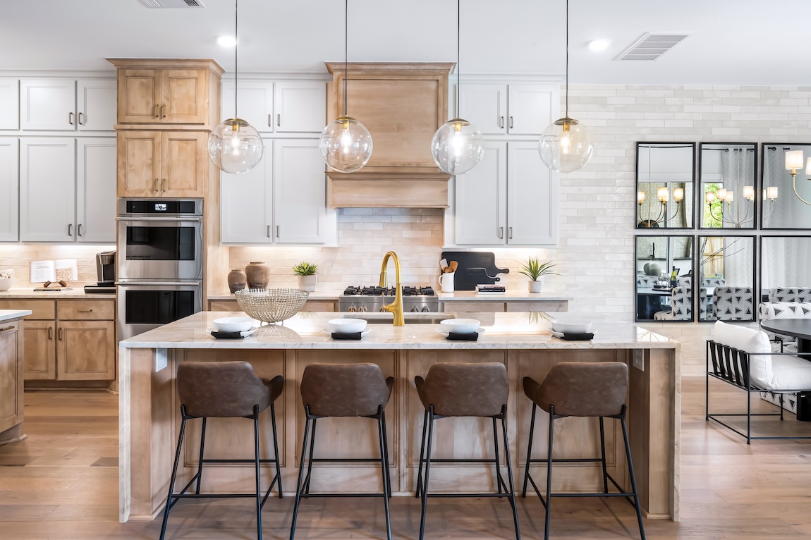 modern kitchen with seating and overhead lighting