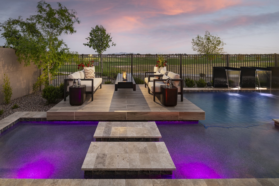 Luxury outdoor fire pit floating above pool