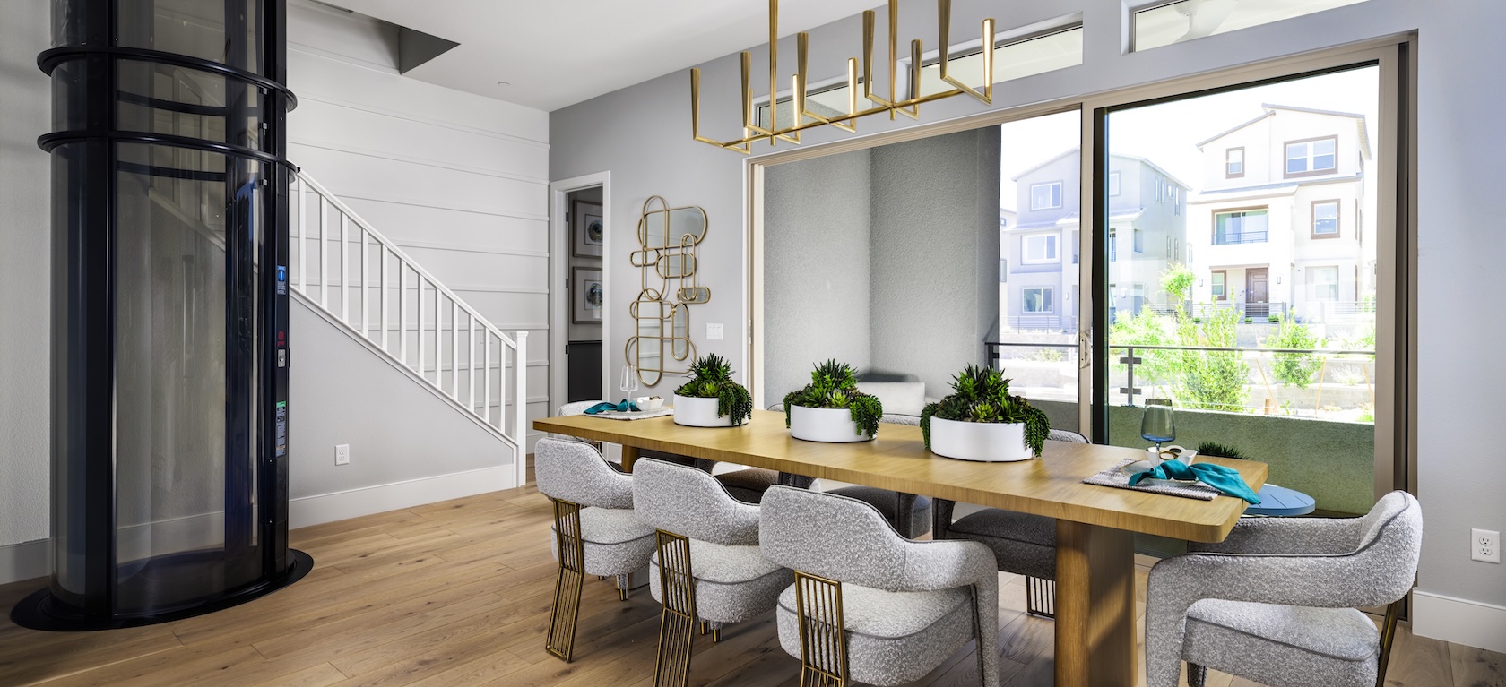 modern dining room with gold fixtures.