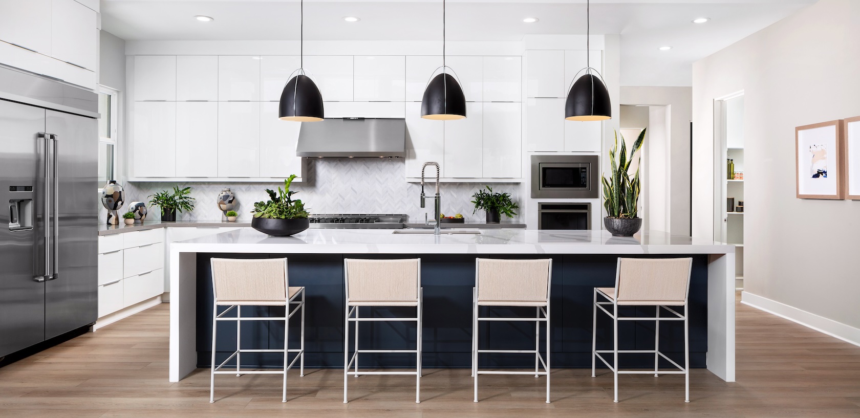 Modern kitchen with island and seating.
