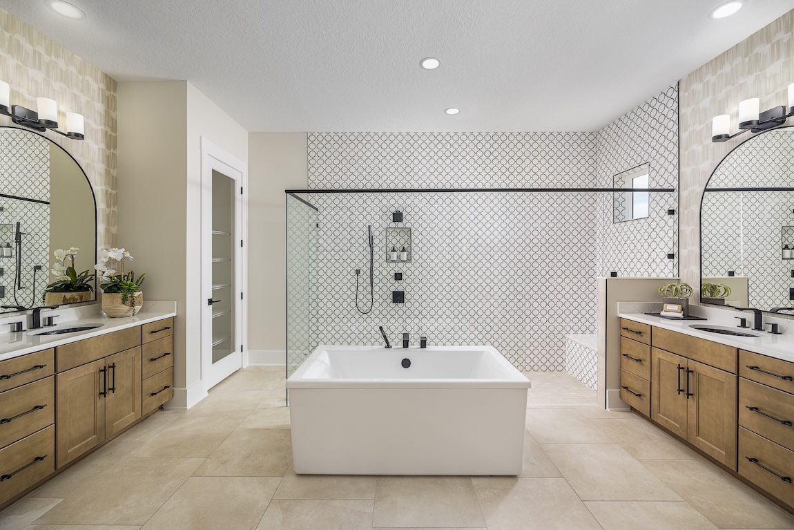 modern freestanding bathtub centered near the shower