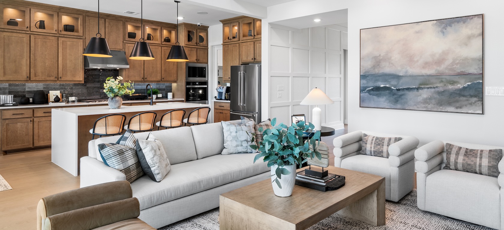 modern living space with sectional couch and flows into the kitchen space