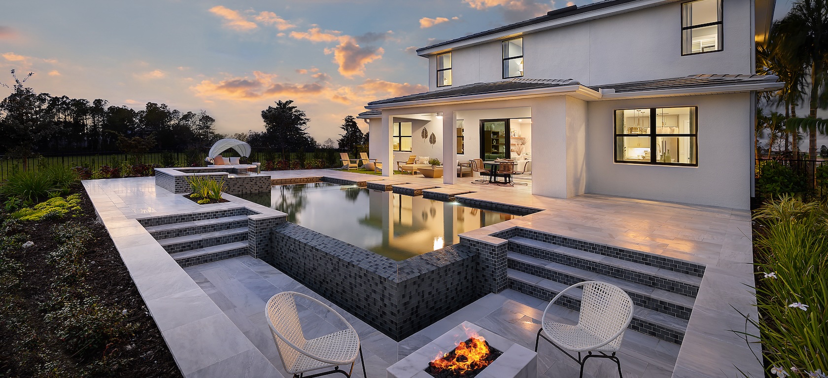 exterior of modern home with pool and fire pit