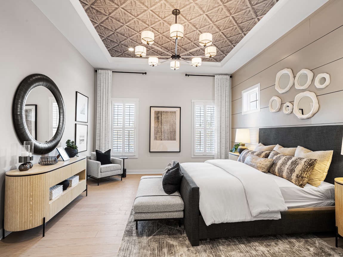 Luxe primary bedroom with classic white interior design