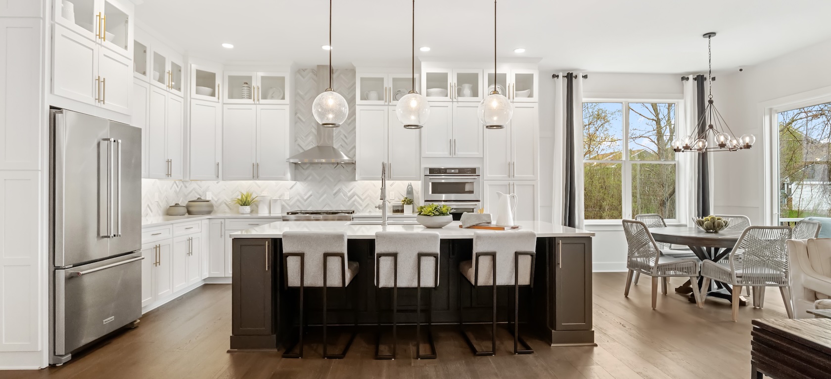 modern kitchen with marble island and pendant lighting